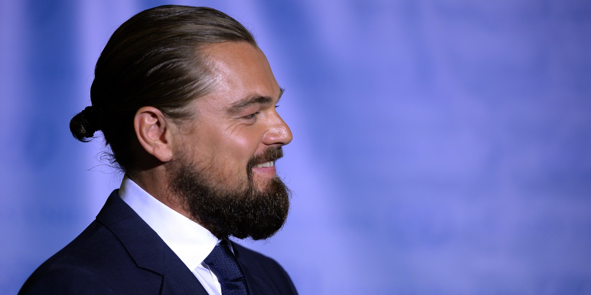 Leonardo DiCaprio with a beard and a suit